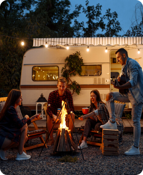 people sitting around a fire