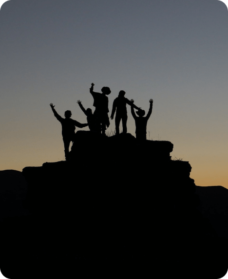 group of friends on a rock